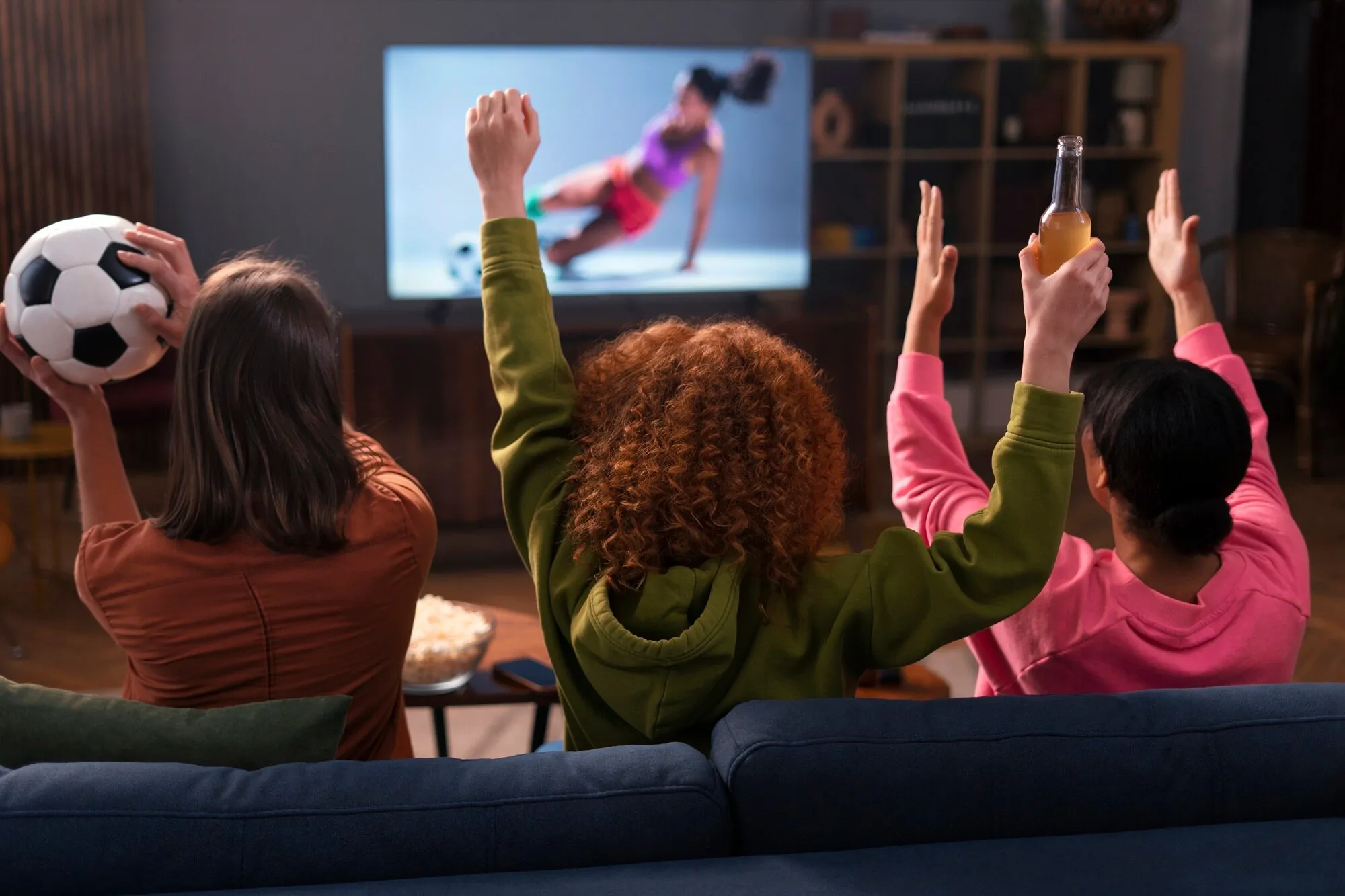 Family enjoying Smart IPTV streaming service - Watch sports and movies on TV